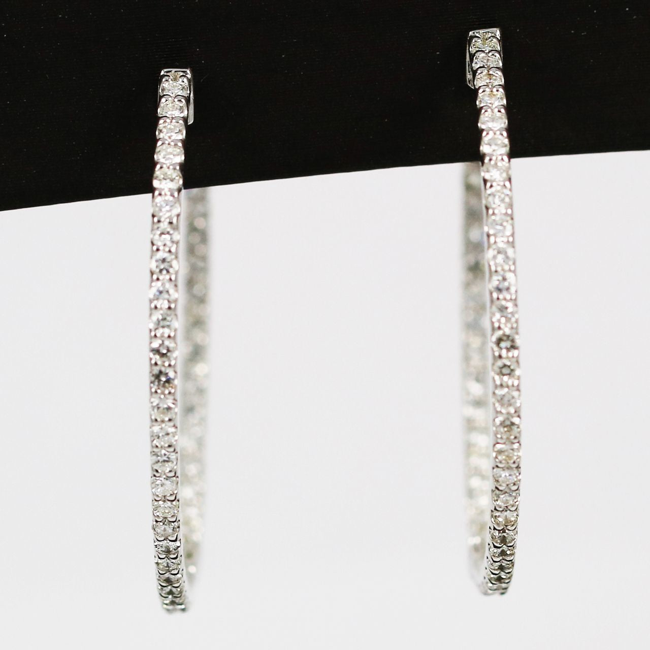 White gold oval hoop earrings